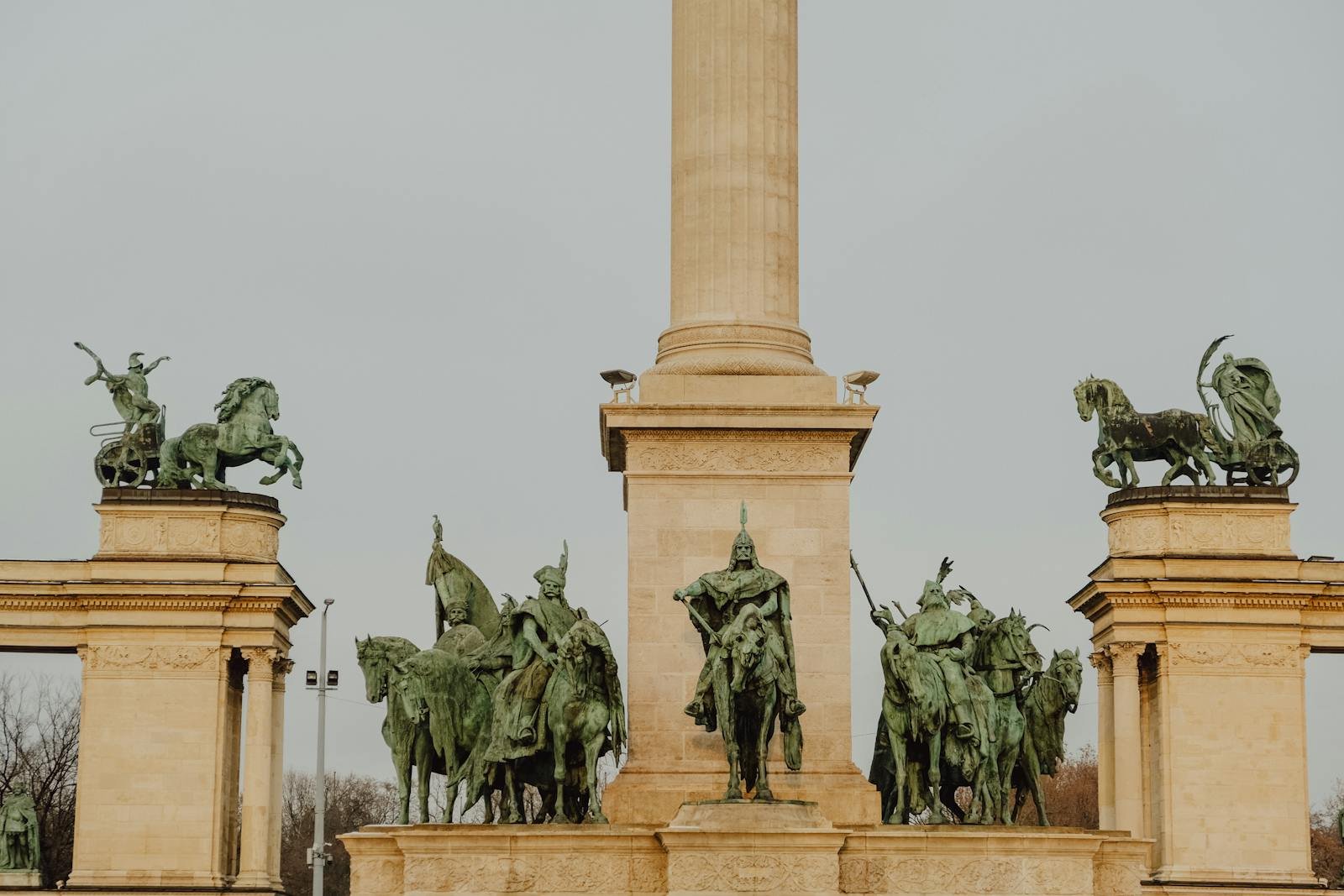 A monument with statues of horses and men